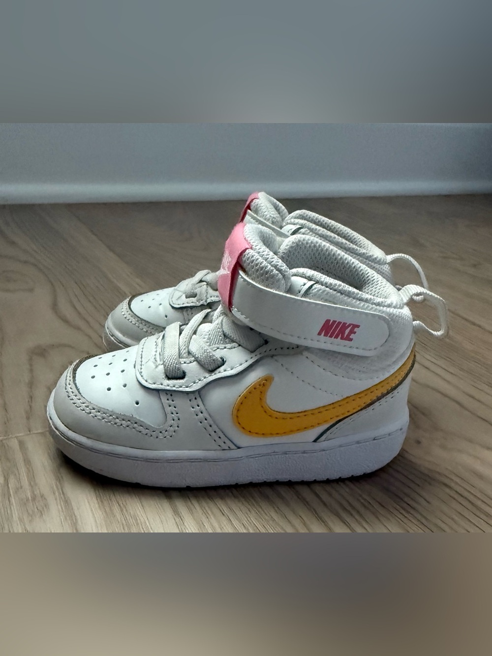 Nike White High-Top Sneakers with Yellow and Pink Accents